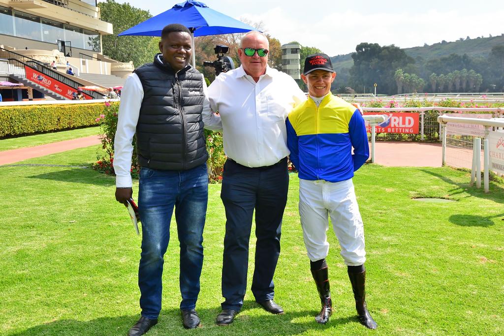 Mike de Kock with Alson Ndlizana and Richard Fourie, who rode a cracking race on Red Hot Rose.